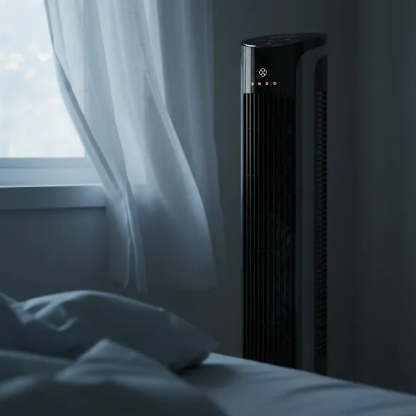 Dreo tower fan effectively cooling a bedroom silently, showing wide air circulation for optimal comfort